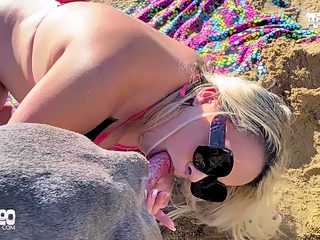 Woman having sex with dog on beach
